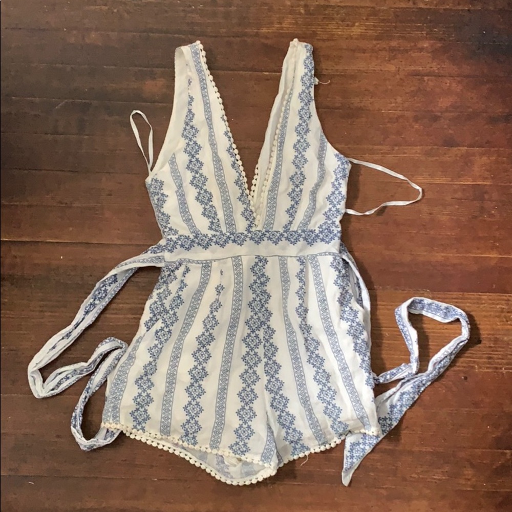 White and light blue stitched romper